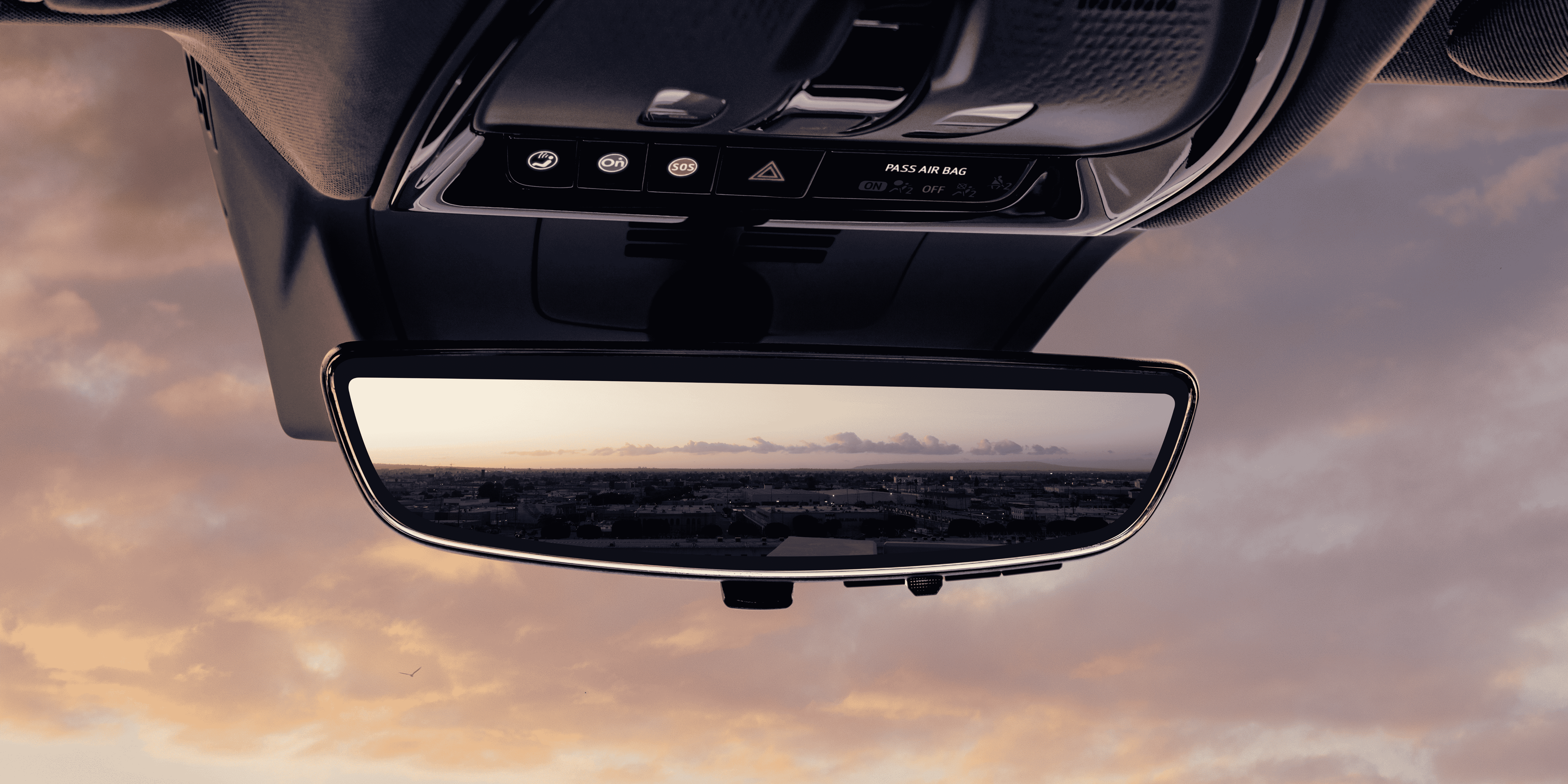 close-up-of-rear-view-mirror-with-a-sunset-background