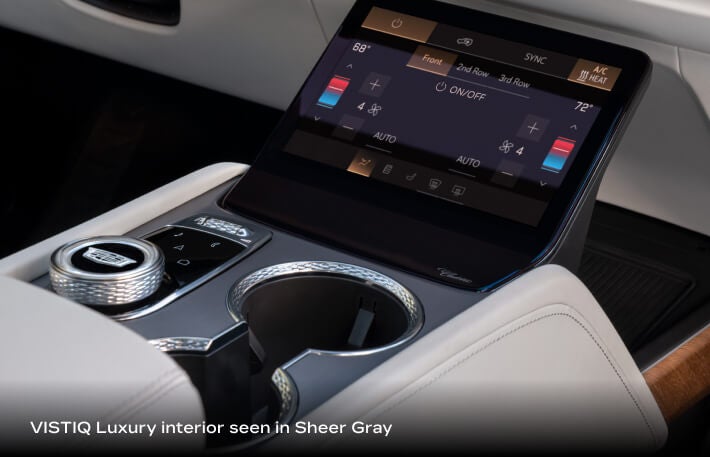 2027 Cadillac VISTIQ Luxury with Sheer Gray interior, showing the climate zone control screen and center console.