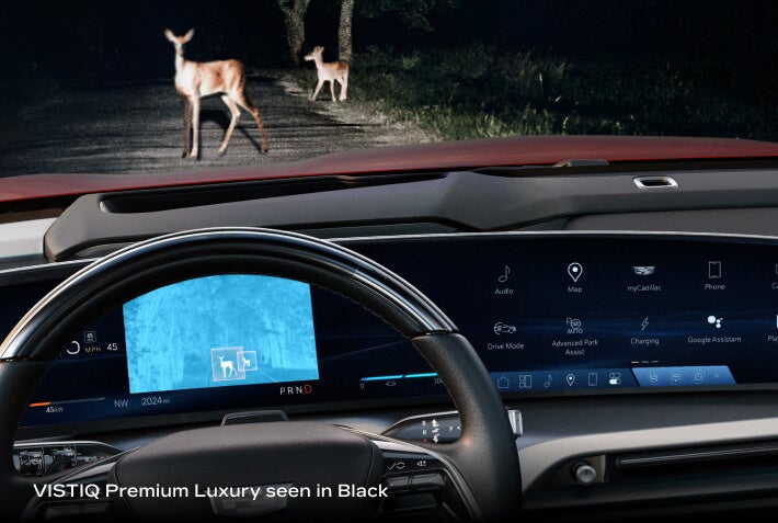 Alt text: 2026 Cadillac VISTIQ Premium Luxury in Black, showing Night Vision detecting deer on a dark road.